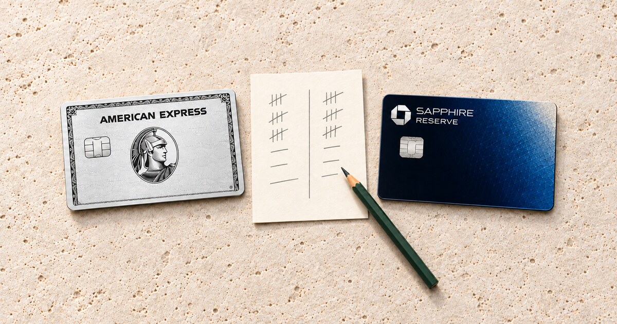 An Amex Platinum card and a Chase Sapphire Reserve card flank a tally sheet and green pencil on pale limestone.